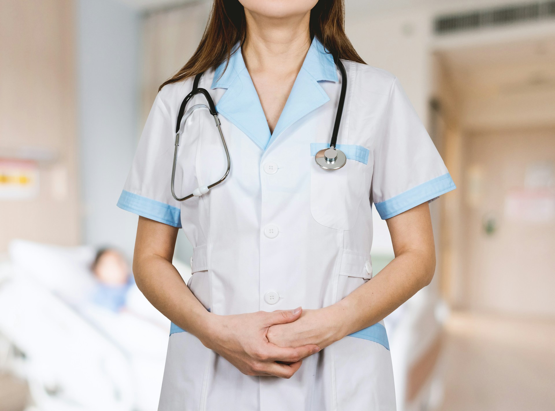 Doctor writing SOAP notes on a clipboard